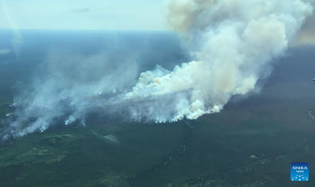 Firefighters battle wildfire fueled by heat wave in Canada