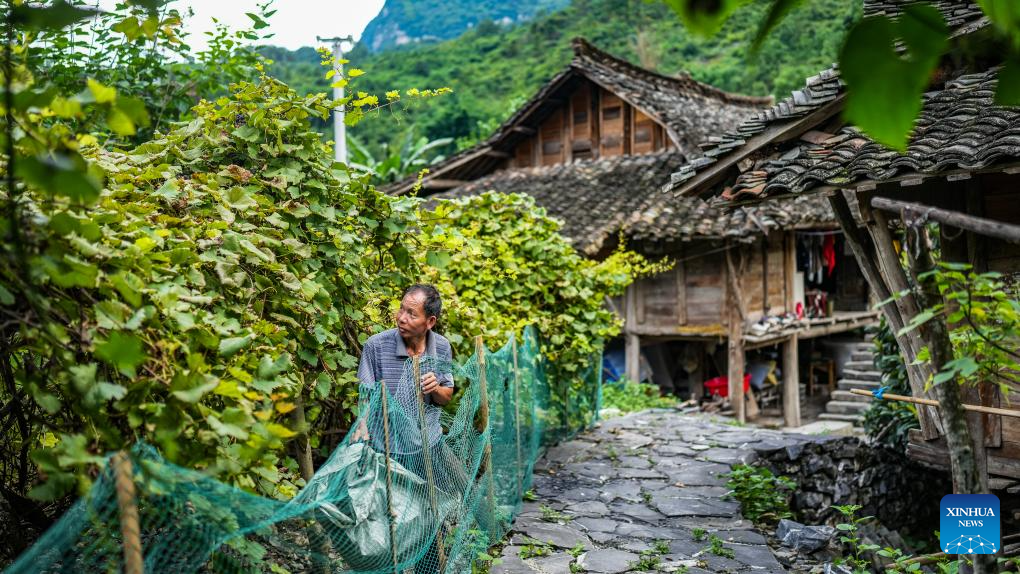 SW China's Tianmen Village features original landscape, traditional folk activities