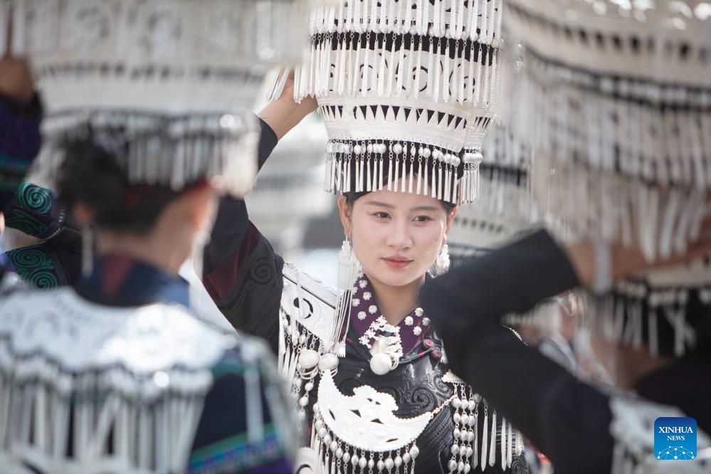 People dressed in traditional Yi costumes celebrate torch festival in China's Sichuan