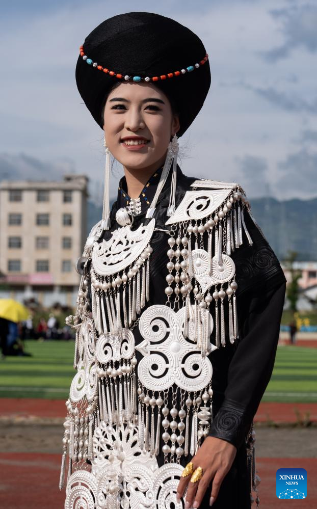 People dressed in traditional Yi costumes celebrate torch festival in China's Sichuan