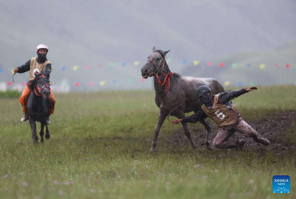 Rural folk event held in Baiyu County, SW China