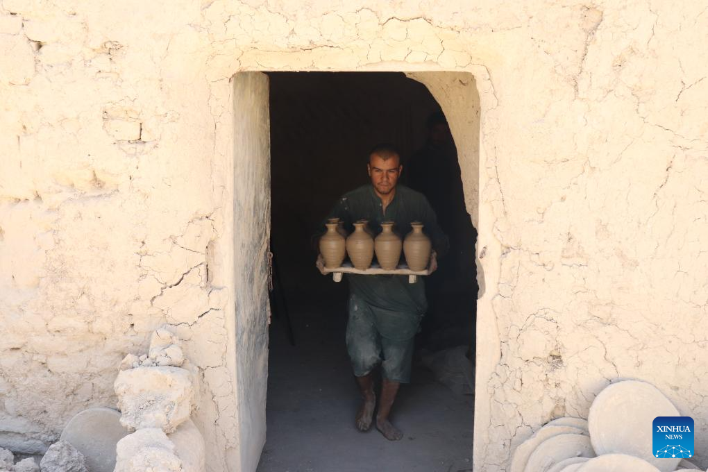 Potters make potteries in Dawlat Abad District, Afghanistan