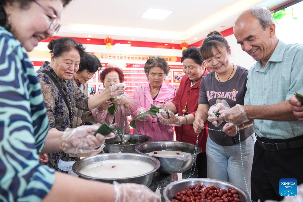 Feature: Xinjiang's multi-ethnic community fosters bonds of support, friendship