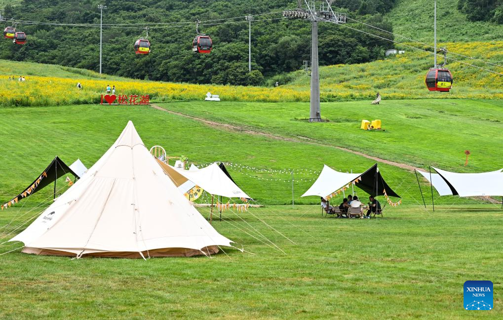 Tourists enjoy summer at ski resorts in Jilin, NE China