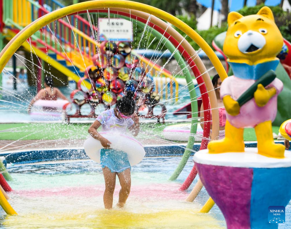 Tourists have fun at water park in Fuling District, SW China's Chongqing