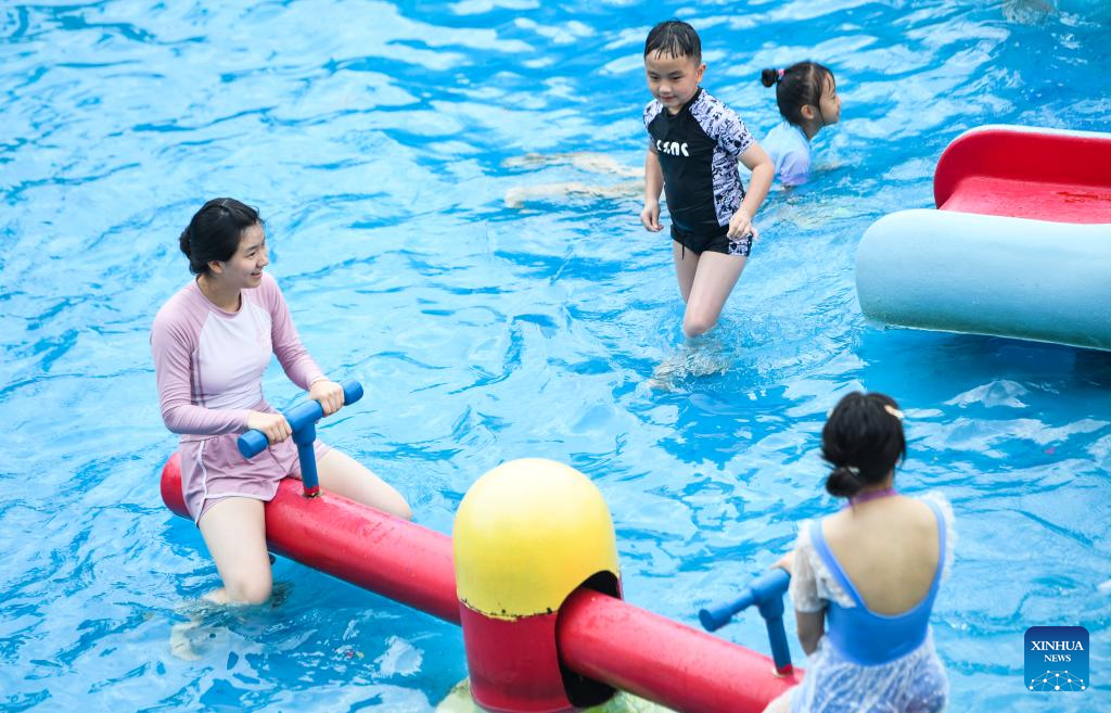 Tourists have fun at water park in Fuling District, SW China's Chongqing