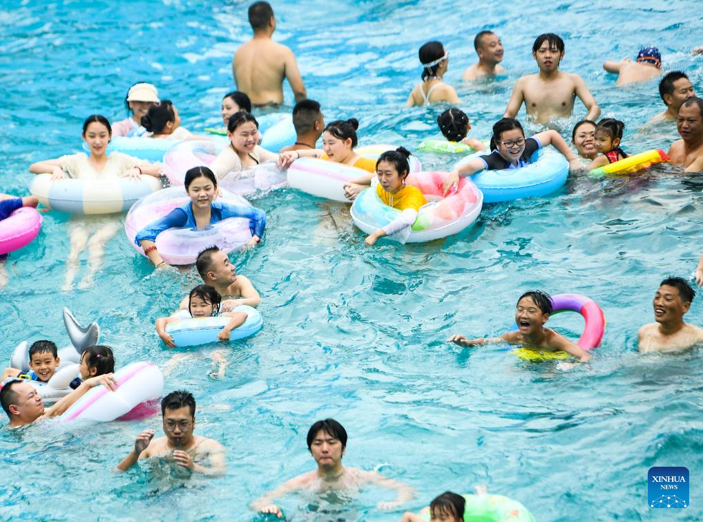 Tourists have fun at water park in Fuling District, SW China's Chongqing