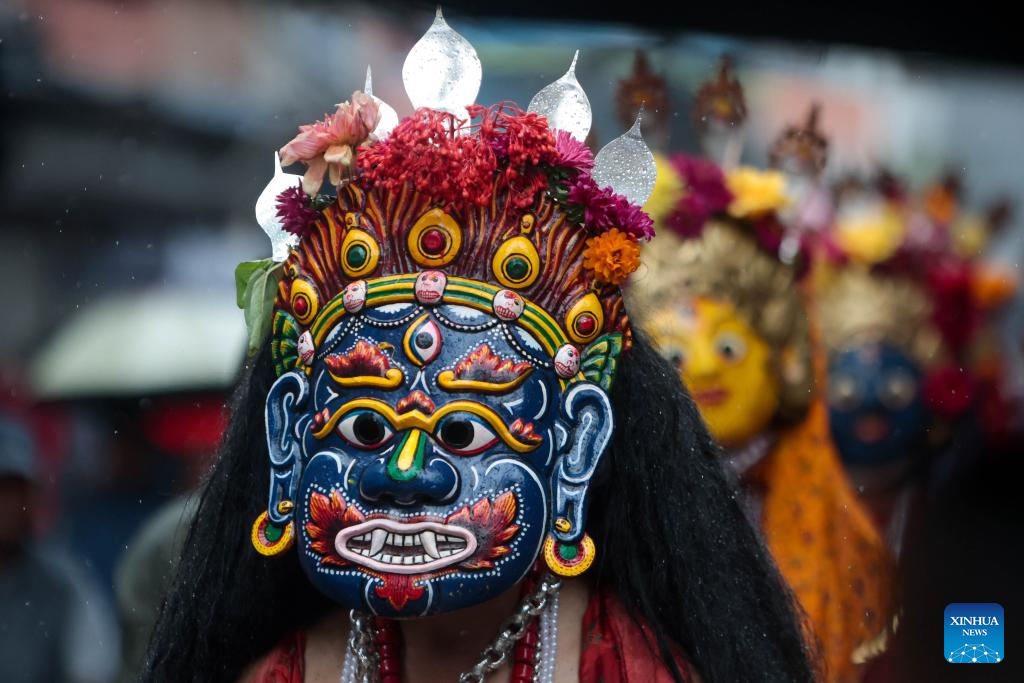 Masked dancers take part in parade in Kathmandu, Nepal