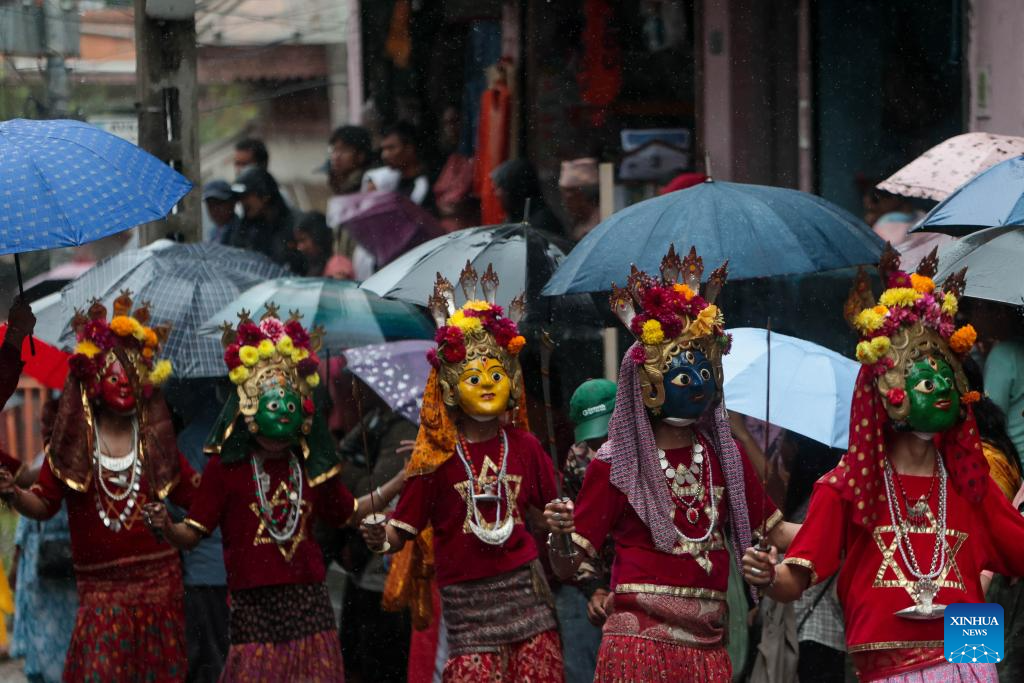 Masked dancers take part in parade in Kathmandu, Nepal