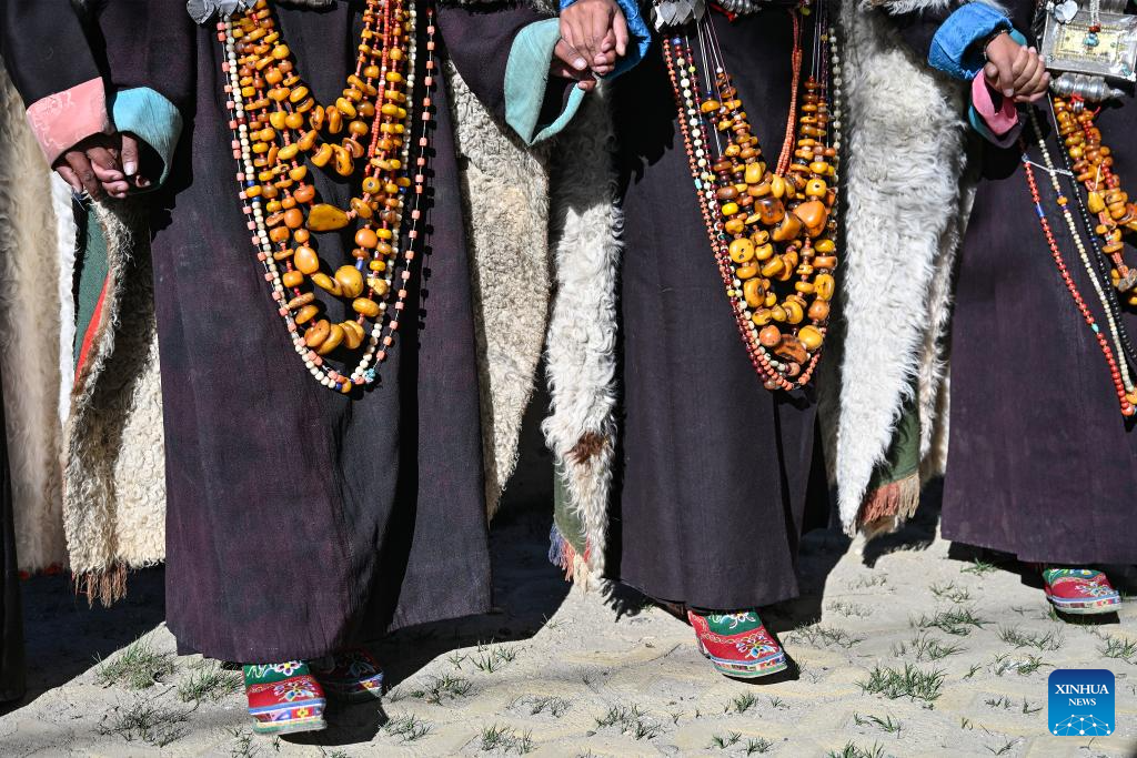 Villagers display folk costume in Pulan County, SW China's Xizang