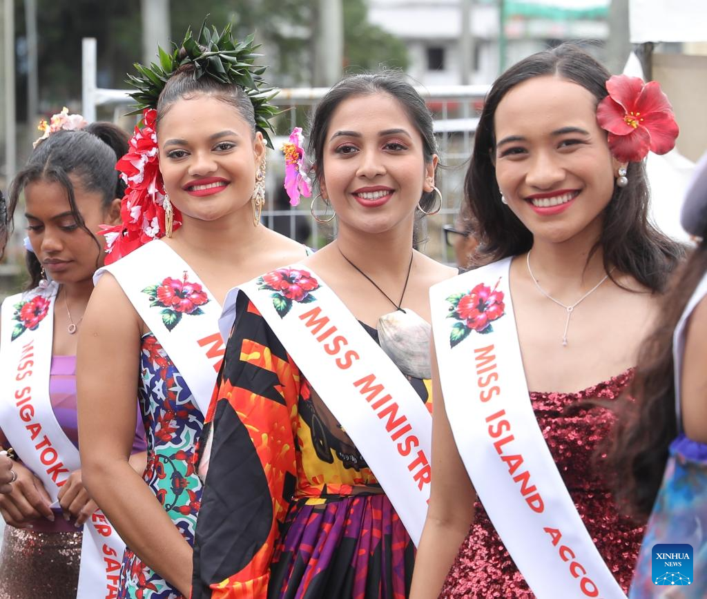 People participate in float parade in celebration of Hibiscus Festival in Fiji