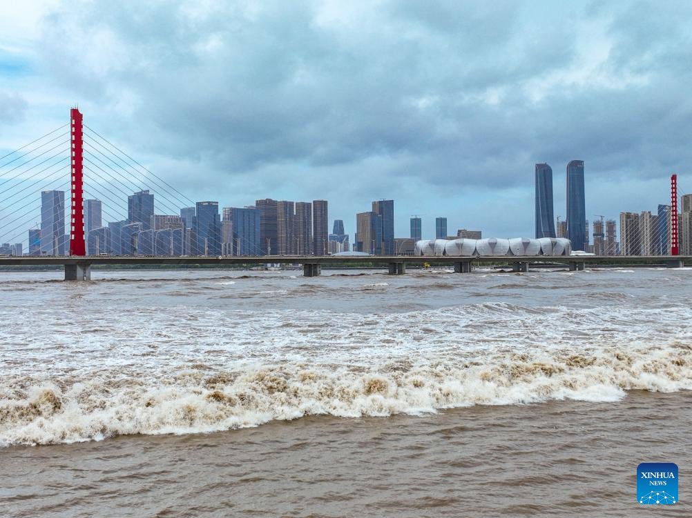 In pics: waves caused by the Qiantang River tidal bore in Hangzhou