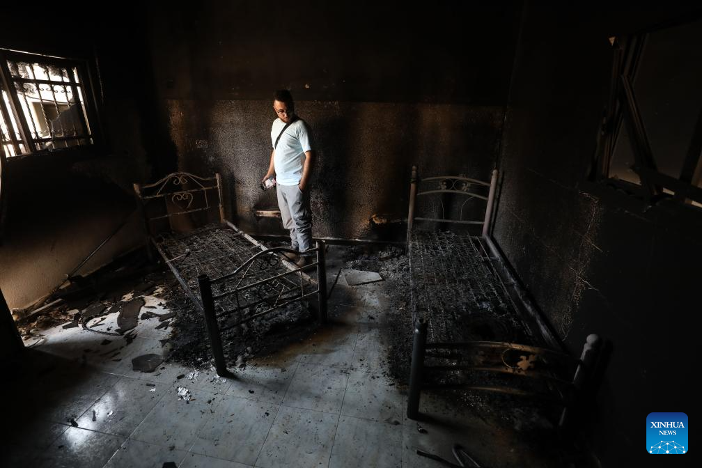 Palestinians check destroyed houses in Jenin