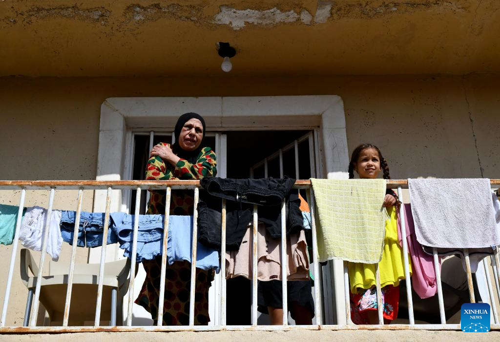 People fleeing from Lebanon seen at Harjalleh shelter center in Syria