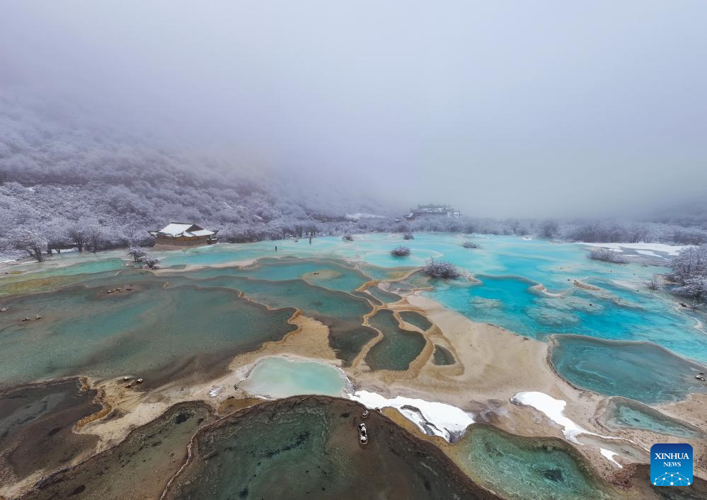 Scenery of colorful pond cluster at Huanglong scenic area in China's Sichuan