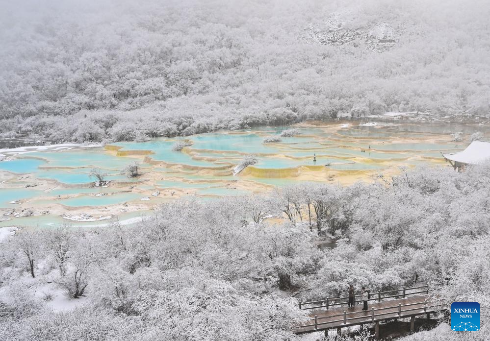 Scenery of colorful pond cluster at Huanglong scenic area in China's Sichuan