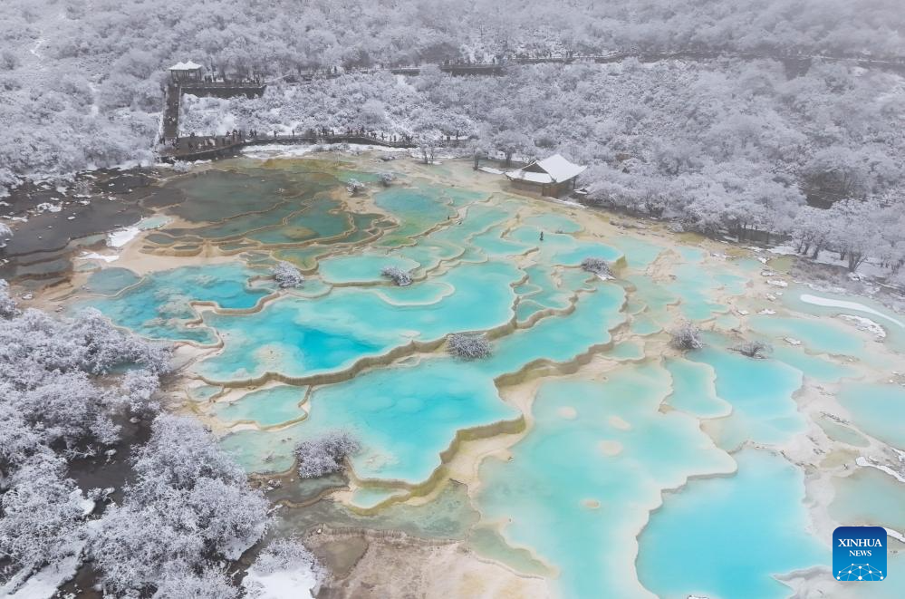 Scenery of colorful pond cluster at Huanglong scenic area in China's Sichuan