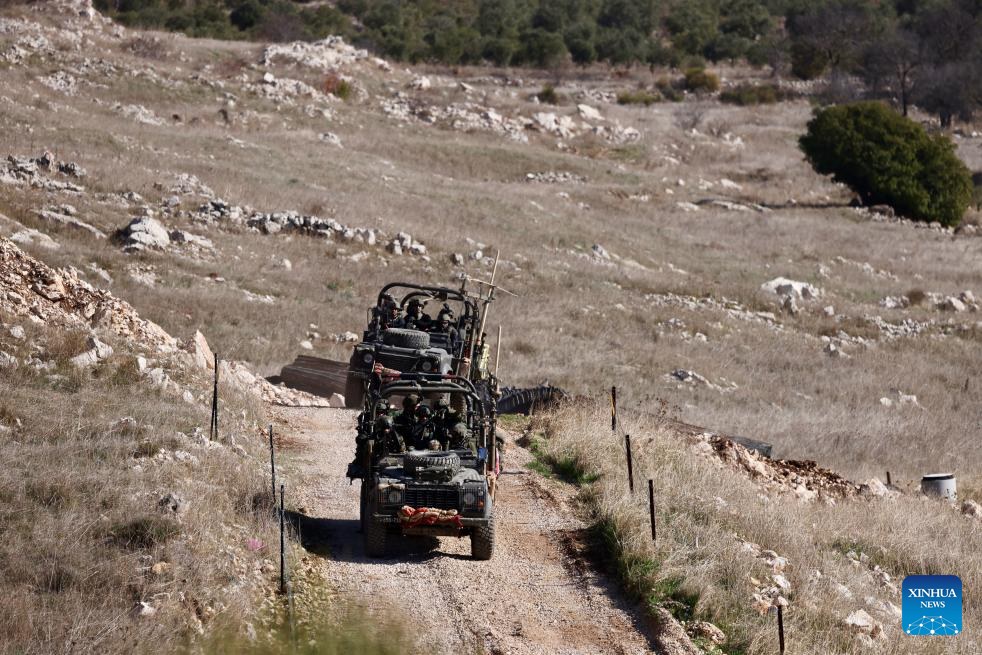 Israeli army controls border areas, strikes strategic weapons in Syria