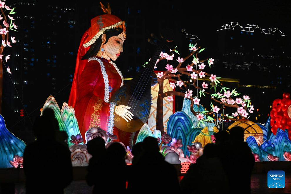 People enjoy light decorations in Hohhot ahead of Spring Festival