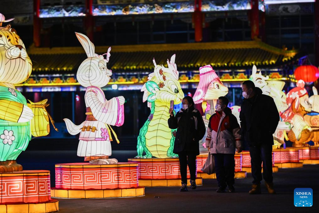 People enjoy light decorations in Hohhot ahead of Spring Festival