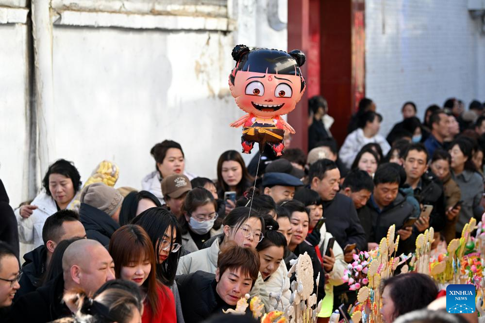 People view dough figurines in Lanxian County of China's Shanxi