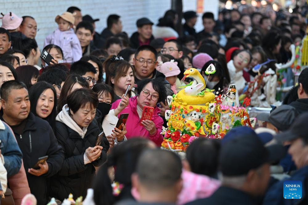 People view dough figurines in Lanxian County of China's Shanxi