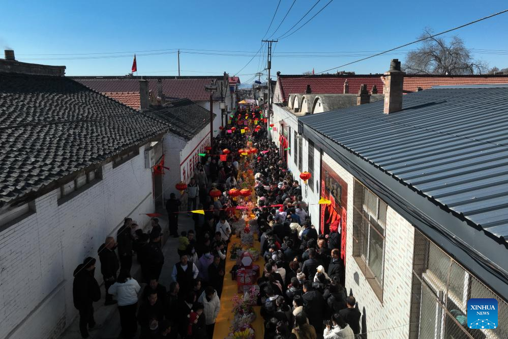 People view dough figurines in Lanxian County of China's Shanxi