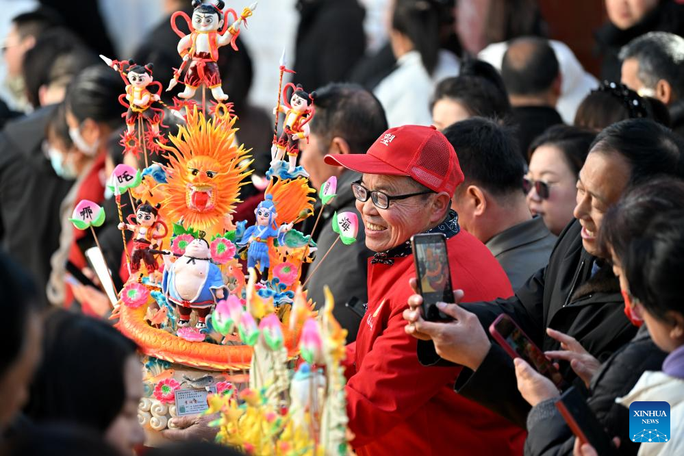 People view dough figurines in Lanxian County of China's Shanxi