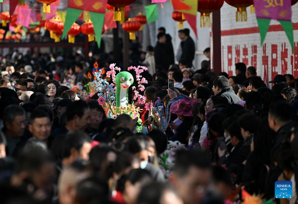 People view dough figurines in Lanxian County of China's Shanxi