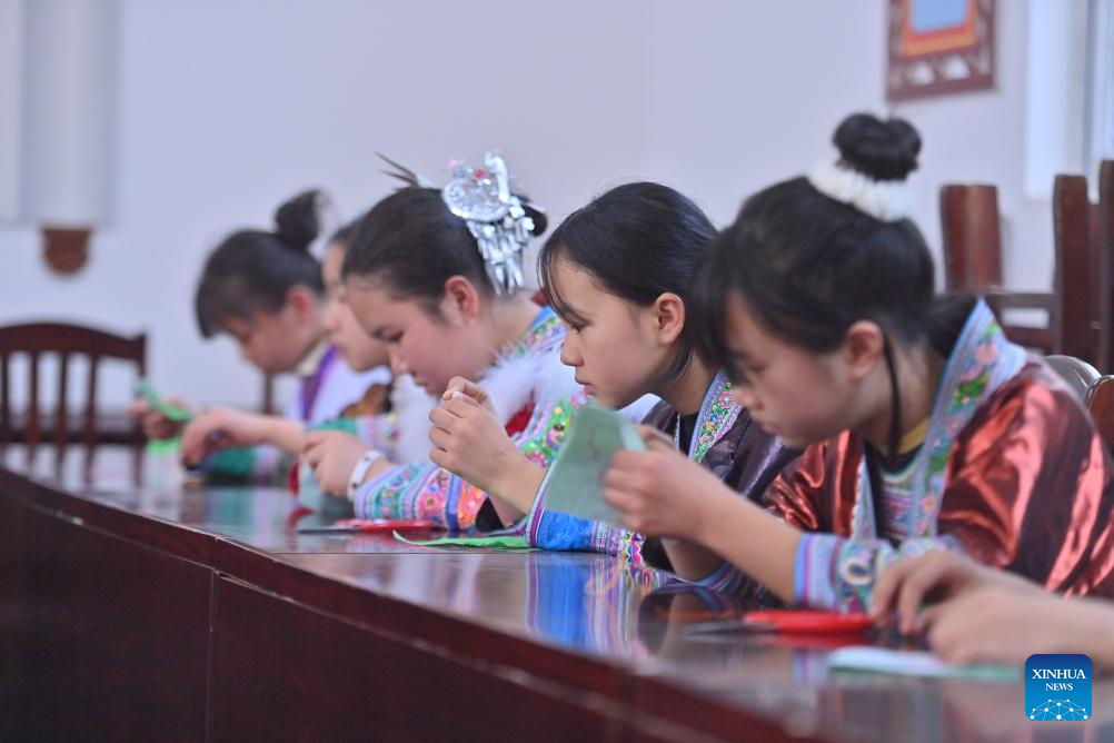 Celebration held before Sanyuesan Festival at primary school in China's Guangxi
