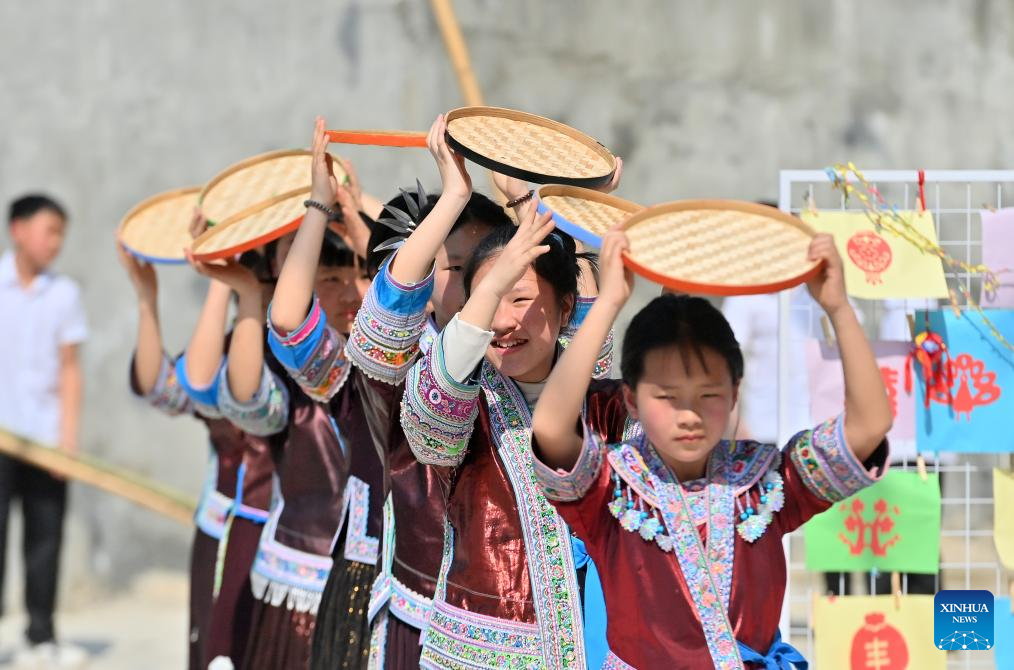 Celebration held before Sanyuesan Festival at primary school in China's Guangxi