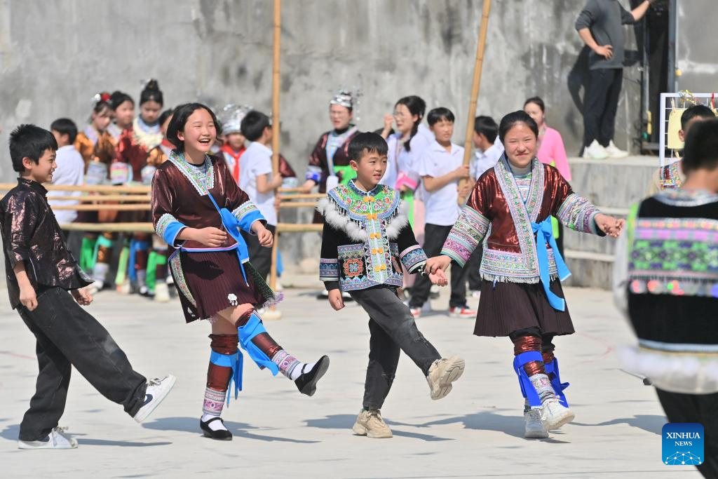 Celebration held before Sanyuesan Festival at primary school in China's Guangxi