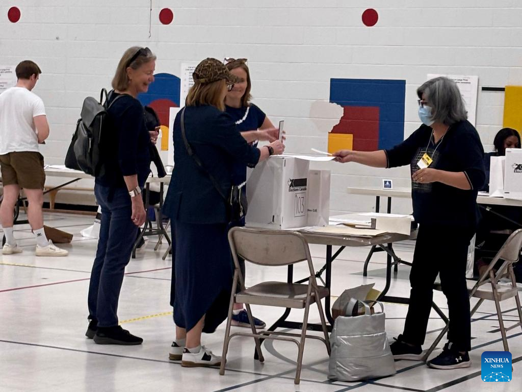 Millions of Canadians turn up for voting amid Trump's fresh threat