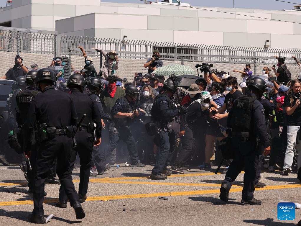 Police clash with protesters in Los Angeles
