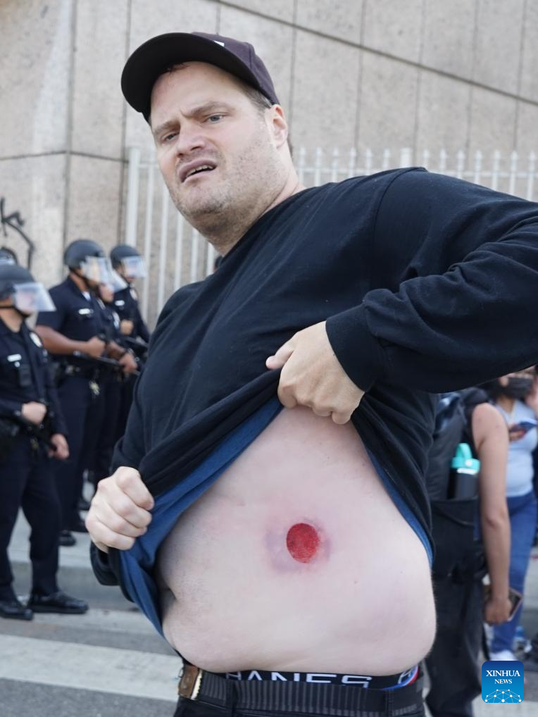 Police clash with protesters in Los Angeles