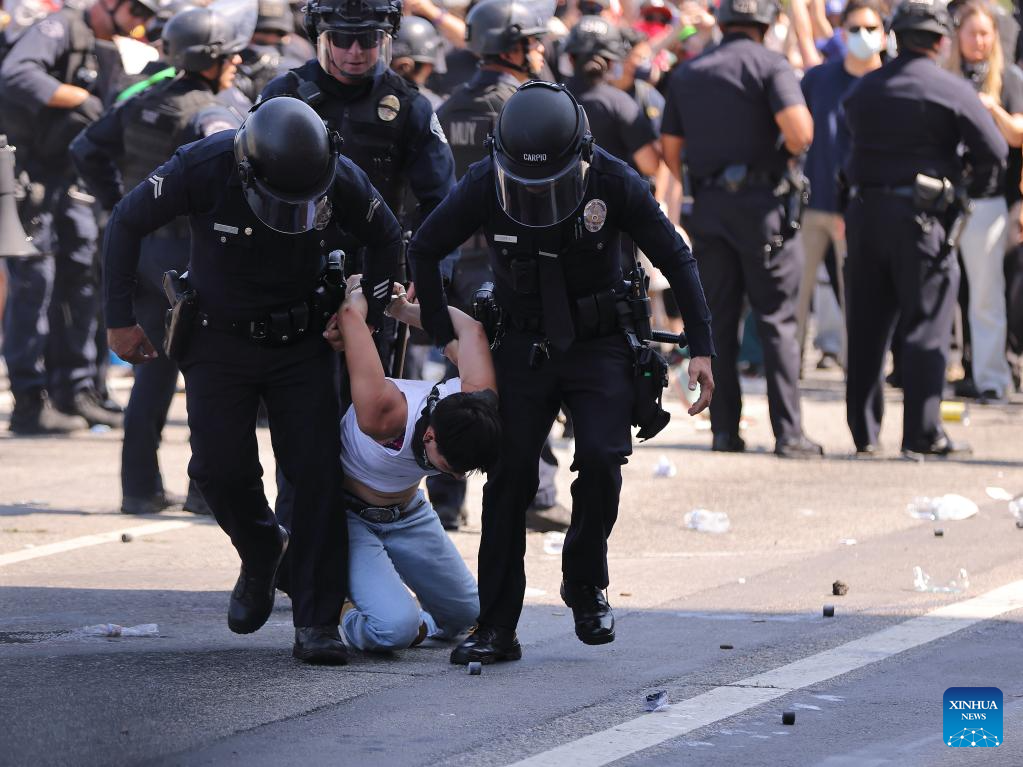 Police clash with protesters in Los Angeles