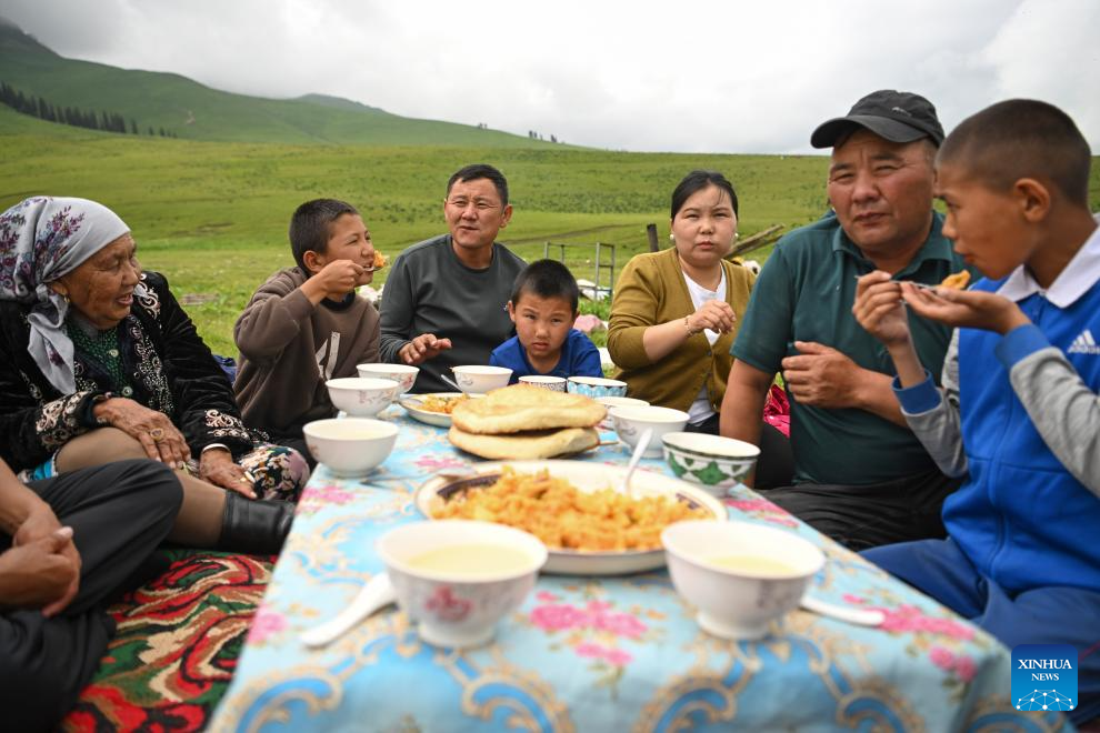 Herder and his summer pasture transfer in NW China's Xinjiang