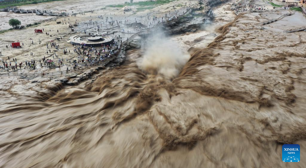 People visit Hukou Waterfall on Yellow River in Jixian County, north China