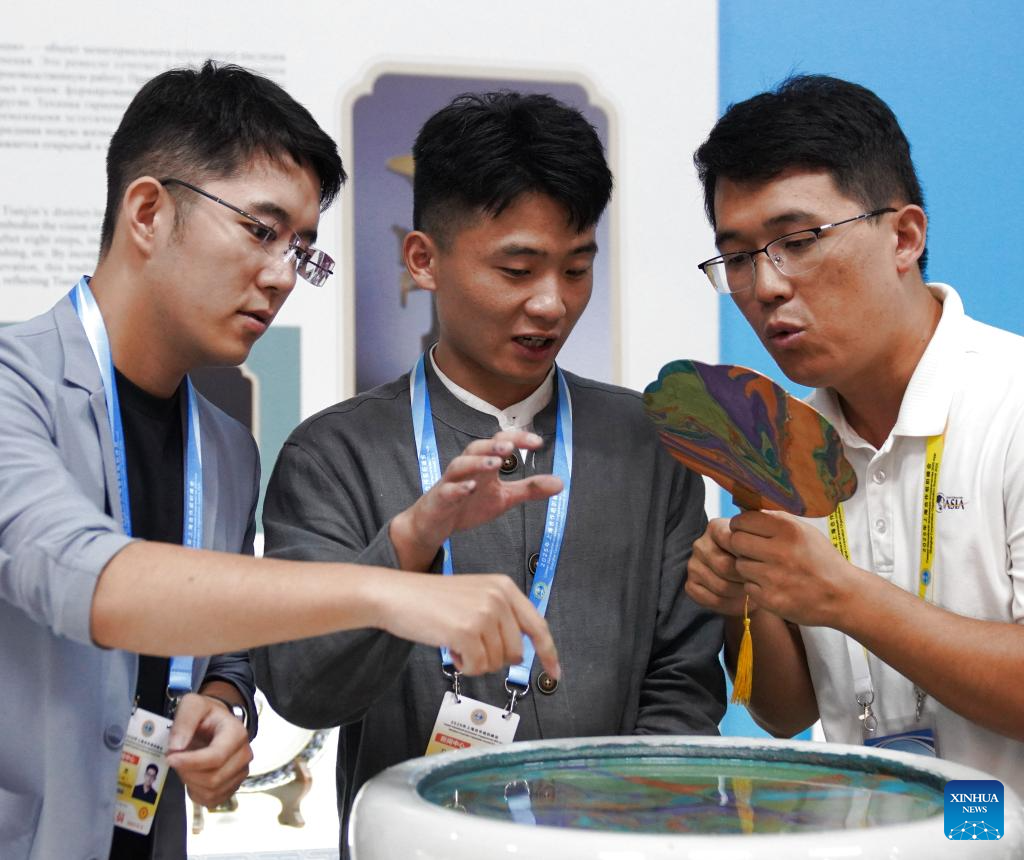 A glimpse of intangible cultural heritage experience zone at press center of SCO Summit 2025 in Tianjin