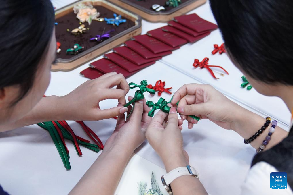 A glimpse of intangible cultural heritage experience zone at press center of SCO Summit 2025 in Tianjin