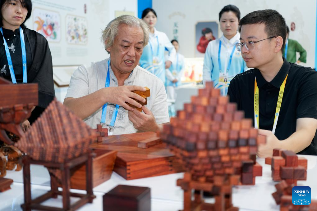A glimpse of intangible cultural heritage experience zone at press center of SCO Summit 2025 in Tianjin
