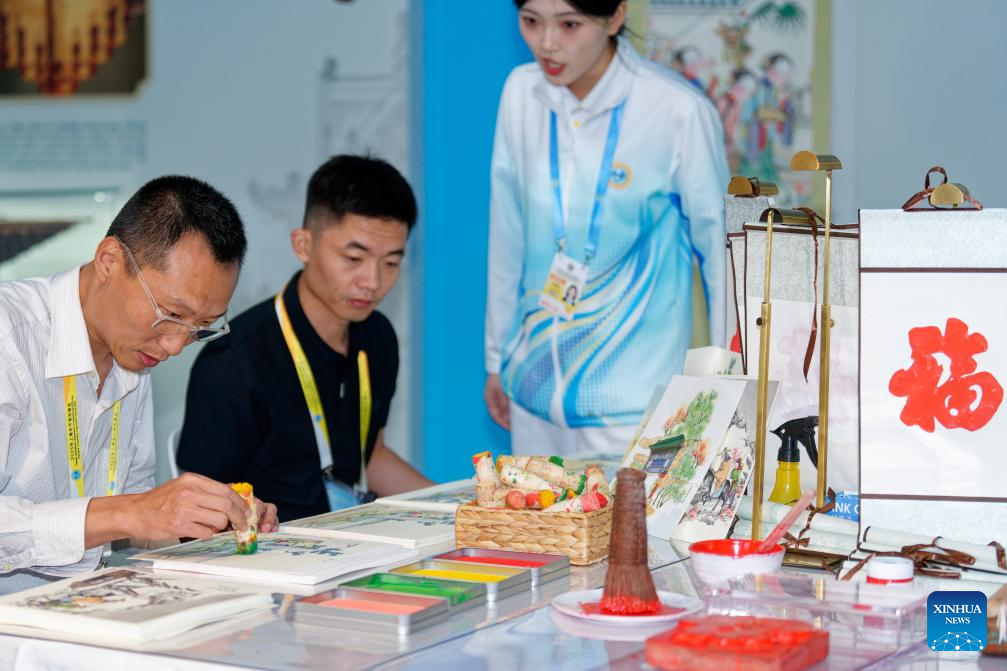 A glimpse of intangible cultural heritage experience zone at press center of SCO Summit 2025 in Tianjin