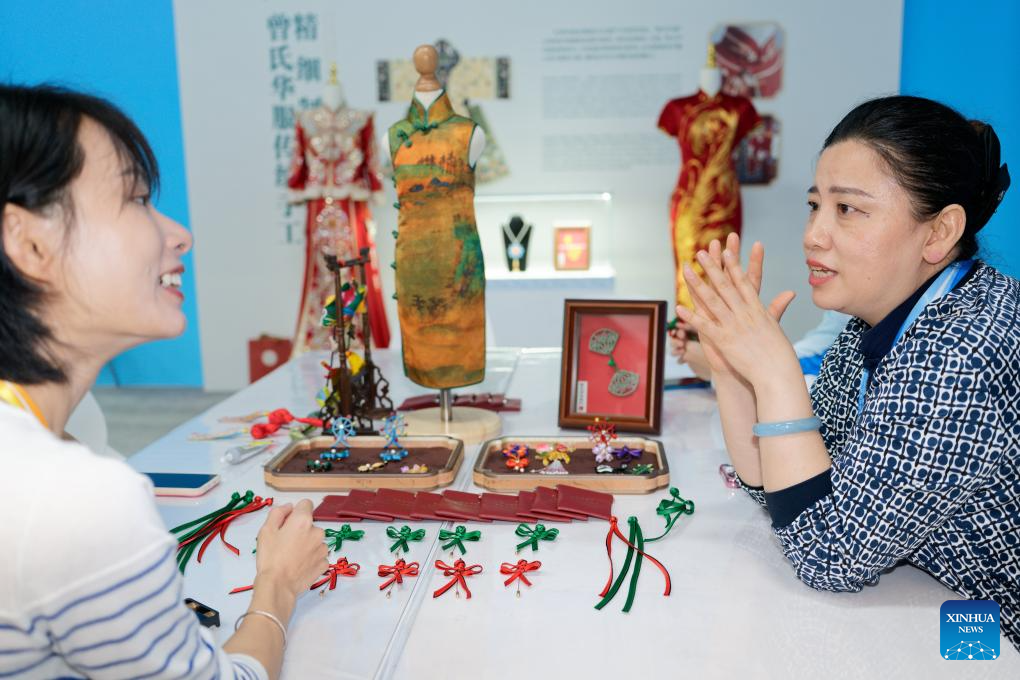A glimpse of intangible cultural heritage experience zone at press center of SCO Summit 2025 in Tianjin