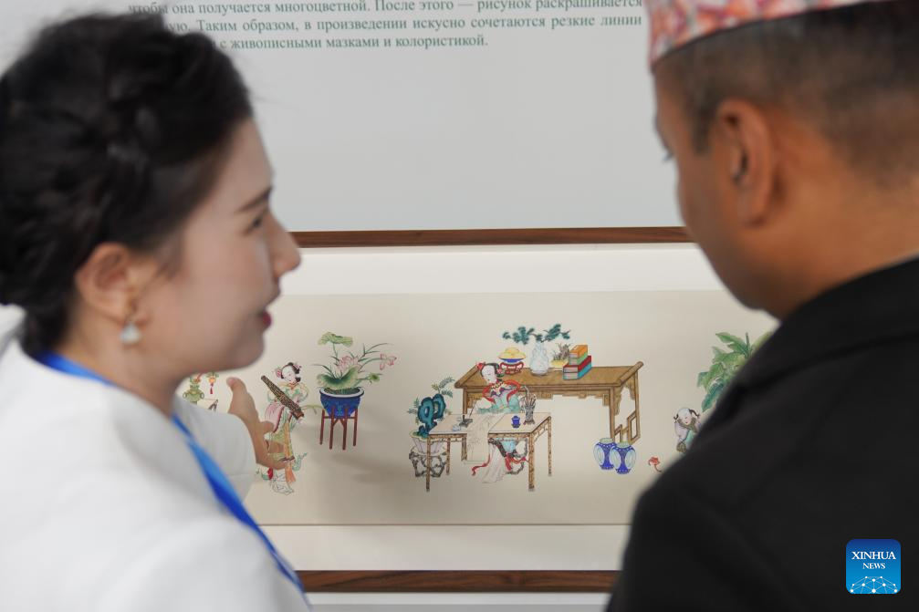 A glimpse of intangible cultural heritage experience zone at press center of SCO Summit 2025 in Tianjin