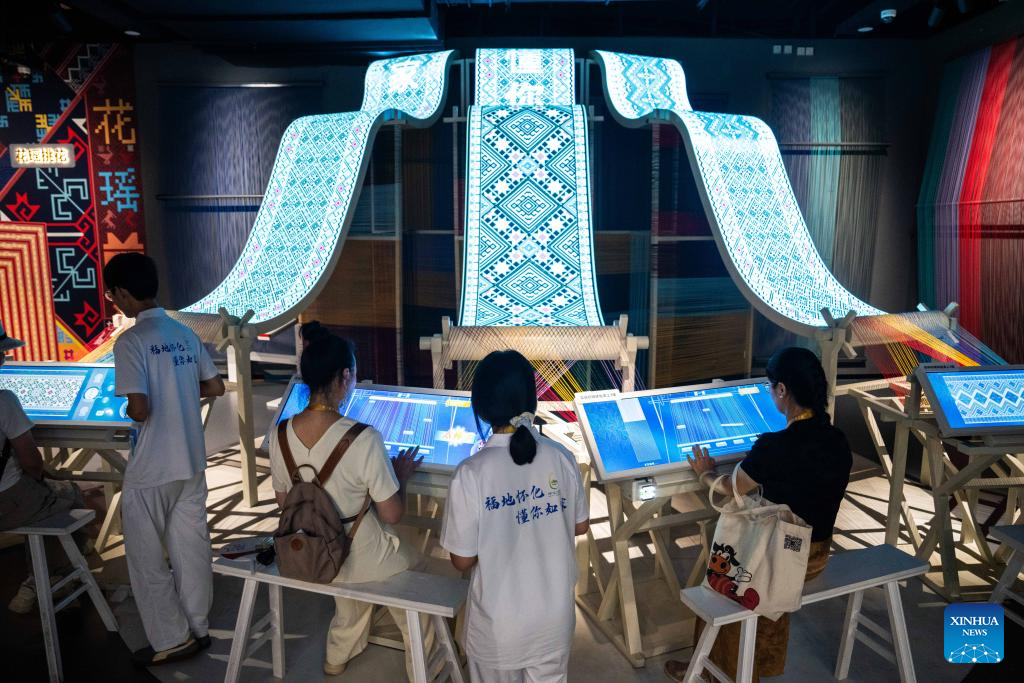 People visit Wuxi Intangible Cultural Heritage Park in Huaihua, China's Hunan