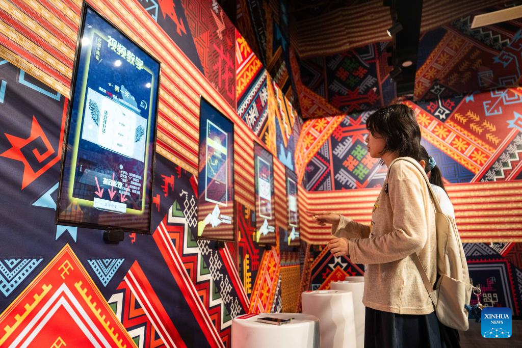 People visit Wuxi Intangible Cultural Heritage Park in Huaihua, China's Hunan