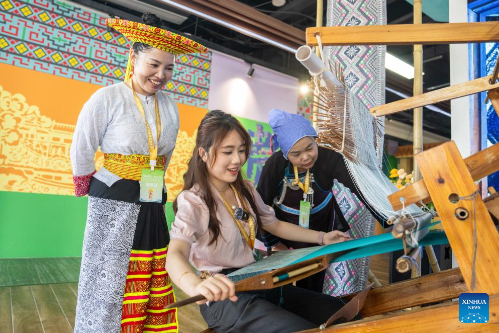 People visit Wuxi Intangible Cultural Heritage Park in Huaihua, China's Hunan