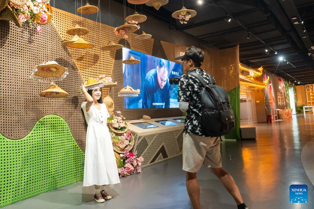 People visit Wuxi Intangible Cultural Heritage Park in Huaihua, China's Hunan