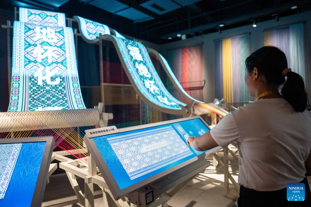 People visit Wuxi Intangible Cultural Heritage Park in Huaihua, China's Hunan