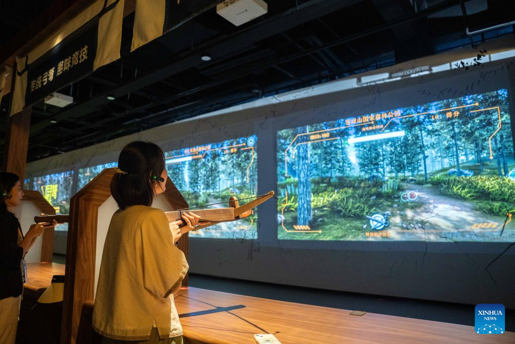 People visit Wuxi Intangible Cultural Heritage Park in Huaihua, China's Hunan